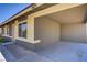 View of an open carport area attached to the house with painted concrete at 4829 Hot Springs Ave, Las Vegas, NV 89110