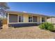 Charming single-story home featuring a gravel front yard and neutral-colored exterior at 4829 Hot Springs Ave, Las Vegas, NV 89110