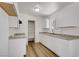 Bright kitchen with white cabinets, granite countertops, and stainless steel appliances at 4829 Hot Springs Ave, Las Vegas, NV 89110