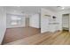Living room and kitchen featuring hardwood floors and carpet, with ample natural light at 4829 Hot Springs Ave, Las Vegas, NV 89110