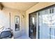 View of a private balcony area featuring a grill, exterior closet, and sliding door access to the interior at 5052 S Rainbow Blvd # 201, Las Vegas, NV 89118