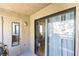 View of a private balcony area featuring a grill, exterior closet, and sliding door access to the interior at 5052 S Rainbow Blvd # 201, Las Vegas, NV 89118