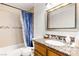 Cozy bathroom featuring granite vanity, framed mirror, and shower/tub combo at 5052 S Rainbow Blvd # 201, Las Vegas, NV 89118