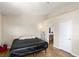 Cozy bedroom with wood-look flooring and access to an ensuite bathroom providing convenience and privacy at 5052 S Rainbow Blvd # 201, Las Vegas, NV 89118