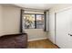 Cozy bedroom with closet, wood-look floors and natural light, perfect for relaxation at 5052 S Rainbow Blvd # 201, Las Vegas, NV 89118