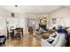 Inviting living room features a fireplace, wood-look flooring, and ample natural light from large windows at 5052 S Rainbow Blvd # 201, Las Vegas, NV 89118