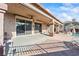 Wide, covered patio with ceiling fans, sliding glass doors, and access to the pool area at 517 Chance Cove Dr, Henderson, NV 89052