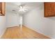 Bedroom with light hardwood floors, white walls, ceiling fan, closet and upper cabinets at 517 Chance Cove Dr, Henderson, NV 89052