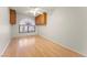 Bright bedroom featuring hardwood floors, neutral walls, cabinets, and a large window at 517 Chance Cove Dr, Henderson, NV 89052