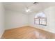 Bright bedroom featuring hardwood floors, neutral walls, and a large window at 517 Chance Cove Dr, Henderson, NV 89052