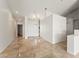 Bright entryway with travertine floors and high ceilings with access to various rooms at 517 Chance Cove Dr, Henderson, NV 89052