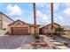 Charming single-story home with desert landscaping, neutral tones, and a two-car garage at 517 Chance Cove Dr, Henderson, NV 89052