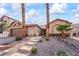 Inviting single-story home with desert landscaping and a pathway to the front door at 517 Chance Cove Dr, Henderson, NV 89052