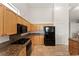 This kitchen boasts granite countertops, light wood cabinets, and stainless-steel appliances at 517 Chance Cove Dr, Henderson, NV 89052