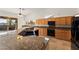 Kitchen features a peninsula island, ample counters, and views of the backyard at 517 Chance Cove Dr, Henderson, NV 89052