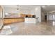 Open kitchen area with granite countertops, light wood cabinets, and tile floors at 517 Chance Cove Dr, Henderson, NV 89052