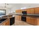 Kitchen features a gas cooktop, ample counter space and storage, and backyard views at 517 Chance Cove Dr, Henderson, NV 89052