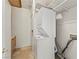 Laundry room with washer, dryer, tile floor, storage cabinet and shelves at 517 Chance Cove Dr, Henderson, NV 89052