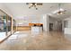 Spacious living room flows into kitchen, featuring tile floors and outdoor access at 517 Chance Cove Dr, Henderson, NV 89052