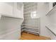 Walk-in closet featuring custom shelving and adjustable hanging rods for versatile storage at 517 Chance Cove Dr, Henderson, NV 89052