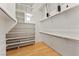 Spacious walk-in closet with custom shelving and hanging rods for organization at 517 Chance Cove Dr, Henderson, NV 89052
