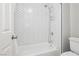Bathroom shower featuring modern white herringbone tiling, and new shower fixtures at 6100 Cocktail Dr, Las Vegas, NV 89130