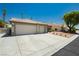 Well-maintained single-story residence with a spacious three-car garage and neat landscaping in a quiet neighborhood at 6100 Cocktail Dr, Las Vegas, NV 89130