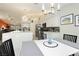 Spacious kitchen and dining area featuring modern lighting and stainless steel appliances at 6100 Cocktail Dr, Las Vegas, NV 89130