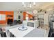 Open floor plan showcasing seamless flow between kitchen, dining, and living areas at 6100 Cocktail Dr, Las Vegas, NV 89130