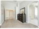 Neutral-toned main bedroom boasts ensuite bath access and generous closet space at 6100 Cocktail Dr, Las Vegas, NV 89130