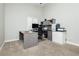 Neutral office featuring carpet, ceiling fan, a large window and a desk with office chair and printer setup at 6100 Cocktail Dr, Las Vegas, NV 89130