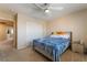 Comfortable bedroom with ceiling fan and ensuite bathroom at 6209 Exquisite Ave, Las Vegas, NV 89110