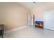 Spacious bedroom features neutral walls, tile flooring, and ample natural light at 6209 Exquisite Ave, Las Vegas, NV 89110
