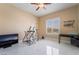 Cozy bedroom with bright natural light and modern ceiling fan at 6209 Exquisite Ave, Las Vegas, NV 89110
