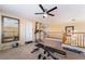 Upstairs bonus room with exercise equipment, neutral carpet, and ceiling fan at 6209 Exquisite Ave, Las Vegas, NV 89110