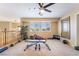 Bright upstairs bonus room has neutral carpet, a ceiling fan, and is perfect for fitness or recreation at 6209 Exquisite Ave, Las Vegas, NV 89110