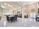 A dining area has shiny floors, chandelier, and great natural light at 6209 Exquisite Ave, Las Vegas, NV 89110