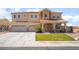 Charming two-story home featuring a three-car garage and well-maintained landscaping at 6209 Exquisite Ave, Las Vegas, NV 89110