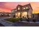 Charming two-story home featuring manicured landscaping and a welcoming front porch at 6209 Exquisite Ave, Las Vegas, NV 89110