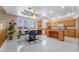The open kitchen features stainless appliances, wood cabinets, and a table at 6209 Exquisite Ave, Las Vegas, NV 89110