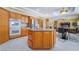 Open kitchen with an island, double ovens, and stainless steel refrigerator at 6209 Exquisite Ave, Las Vegas, NV 89110