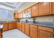 Bright kitchen featuring stainless steel appliances, granite countertops, and ample cabinet space at 6209 Exquisite Ave, Las Vegas, NV 89110