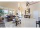 Bright living room with high ceilings, chandelier, and elegant furnishings at 6209 Exquisite Ave, Las Vegas, NV 89110