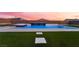 Backyard with a sparkling pool, waterfall feature, and artificial grass at 6209 Exquisite Ave, Las Vegas, NV 89110