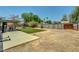 Expansive backyard with lawn, patio area, and ample space for outdoor activities and relaxation at 671 Riata Way, Las Vegas, NV 89110