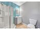 Bathroom featuring shower with glass doors, vanity and toilet at 671 Riata Way, Las Vegas, NV 89110