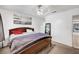 Bedroom with carpet, art and ceiling fan includes a queen bed at 671 Riata Way, Las Vegas, NV 89110