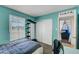 Bright bedroom featuring a large window and ample closet space, perfect for rest and storage at 671 Riata Way, Las Vegas, NV 89110