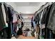 Walk-in closet features clothing racks and shelves for optimal storage at 671 Riata Way, Las Vegas, NV 89110