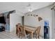 Inviting dining area with wooden table, tiled floor, and wall-mounted Hawaiian island decorations at 671 Riata Way, Las Vegas, NV 89110